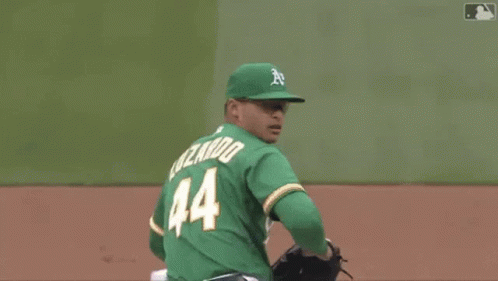 Baseball Player Number 15 Swinging at Pitch