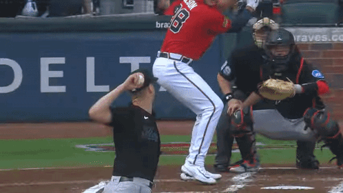 Baseball Player Number 18 Swinging