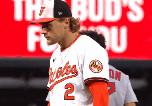 Baseball Player Number 2 in Front of BUD'S FOR YOU Banner