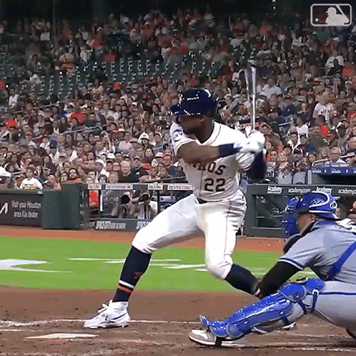 Baseball Player Number 22 Swinging at Pitch