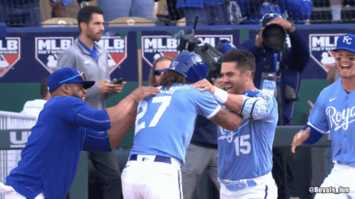 Baseball Player Number 27 Hugging Teammate