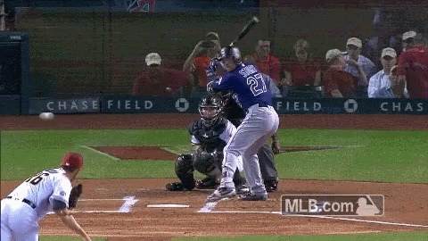 Baseball Player Number 27 Swinging at Pitch