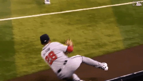 Baseball Player Number 28 Diving to Catch