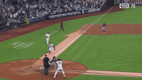 Baseball Player Number 35 Sliding Into Home Plate