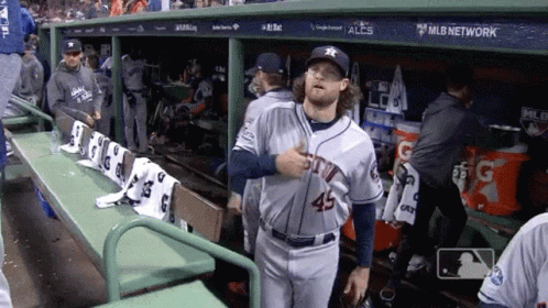 Baseball Player Number 45 in Dugout