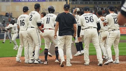Baseball Player Number 56 With Teammates