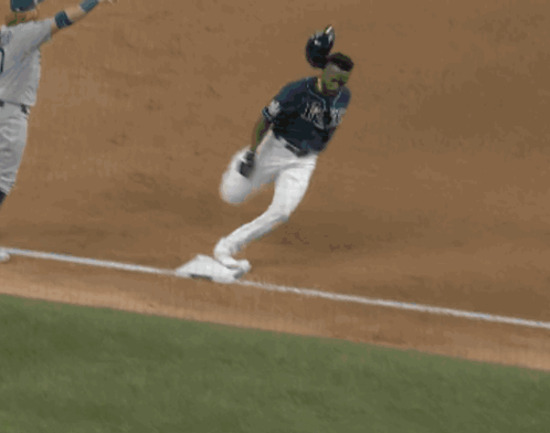Baseball Player Number 9 Sliding Into Base