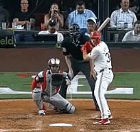 Baseball Player Ready to Hit With Catcher and Umpire