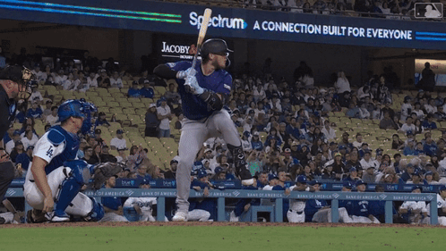 Baseball Player Ready to Swing at Pitch With Spectrum Sign