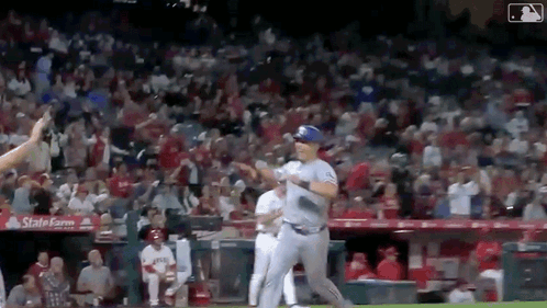 Baseball Player Running To Dugout With Crowd GIF