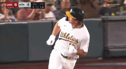 Baseball Player Running Towards Home Plate