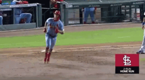 Baseball Player Running Towards Home Plate