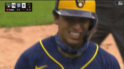 Baseball Player Smiling in Yellow Helmet