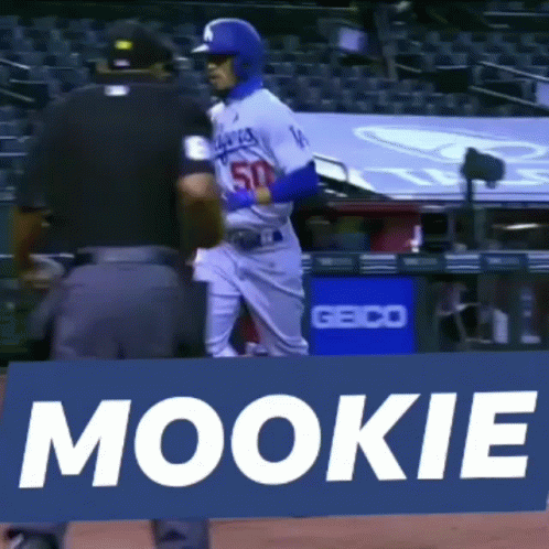 Baseball Player Standing in Front of Mookie Sign