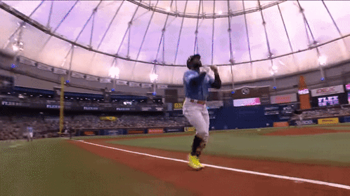 Baseball Player Swinging at Ball in Stadium With Flex Walls
