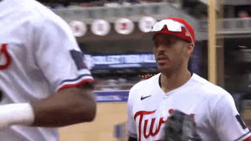 Baseball Player Swinging at Ball with Rally Sausage