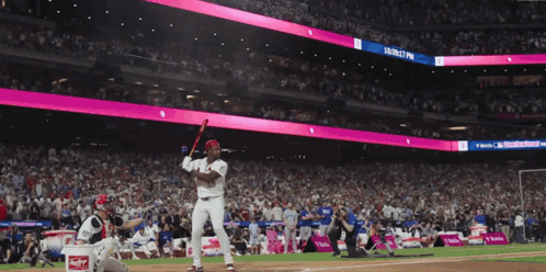 Baseball Player Swinging at Magenta Ball Sign
