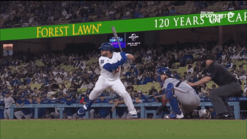 Baseball Player Swinging at Pitch