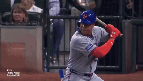 Baseball Player Swinging at Pitch