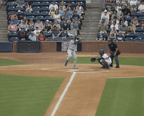 Baseball Player Swinging at Pitch