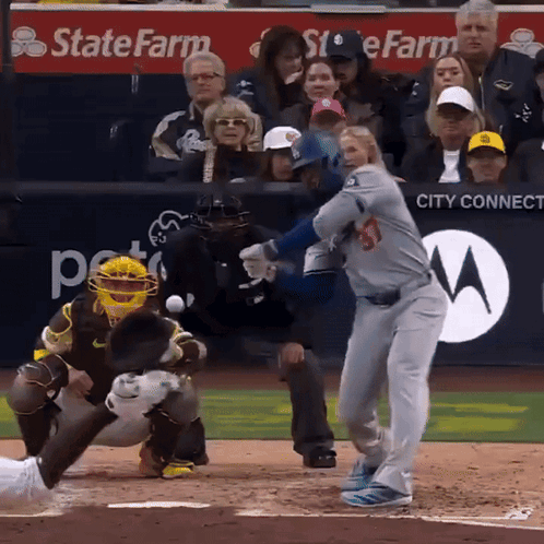 Baseball Player Swinging at Pitch