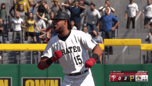 Baseball Player Swinging at Pitch With Crowd Watching