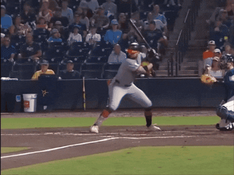 Baseball Player Swinging at Pitch with True Sign