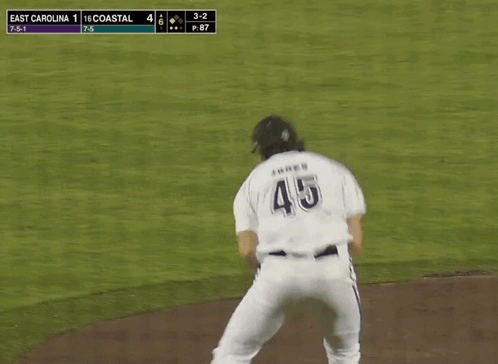 Baseball Player Swinging Bat at Ball in Front of SBC Banner
