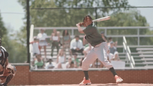 Baseball Player Swinging Bat at Ball