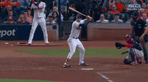 Baseball Player Swinging Bat at Chevron Sign