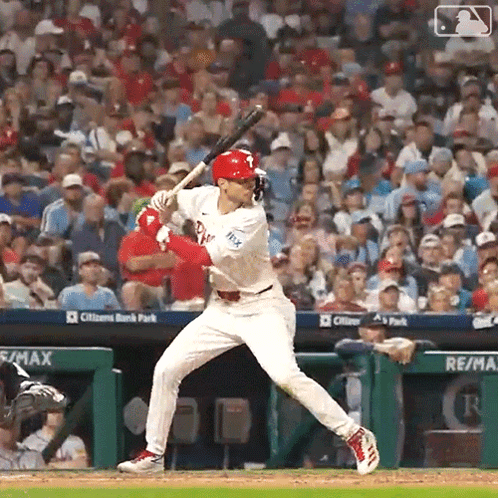 Baseball Player Swinging Bat at Game