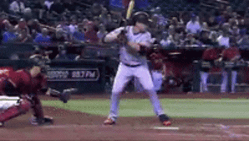 Baseball Player Swinging Bat