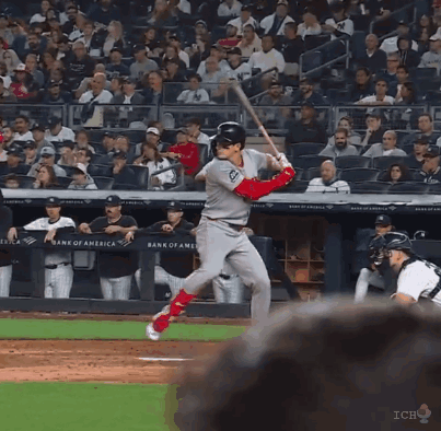 Baseball Player Swinging Bat in Front of Bank of America Ad