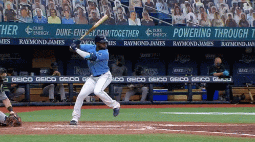 Baseball Player Swinging Bat in Front of Duke Energy Banner