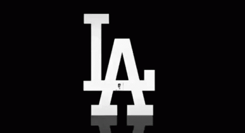 Baseball Player Swinging Bat in Front of LA