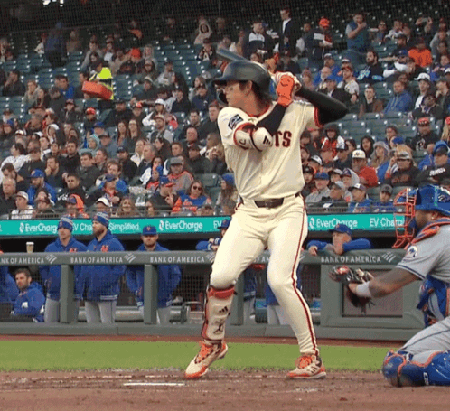 Baseball Player Swinging Bat in Giants Uniform