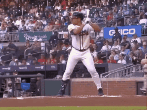 Baseball Player Swinging Bat In Stadium GIF