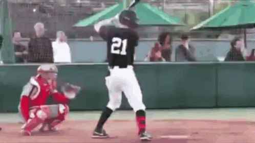 Baseball Player Swinging Bat