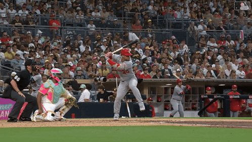 Baseball Player Swinging Bat With Catcher Watching GIF
