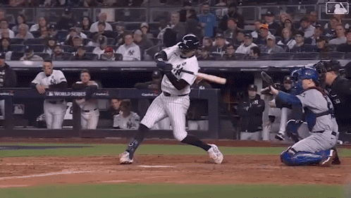 Baseball Player Swinging Bat with Catcher Watching