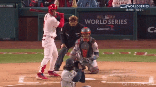 Baseball Player Swinging Bat