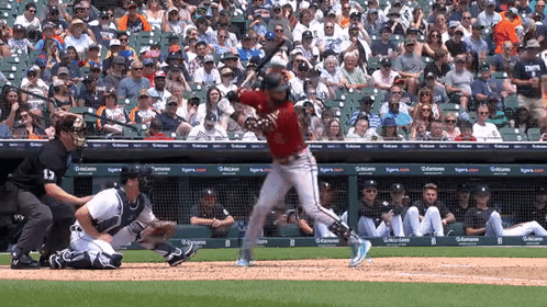 Baseball Player Swings Bat At Pitch With Tigers Crowd GIF