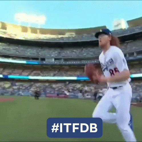 Baseball Player Throwing Ball in Stadium
