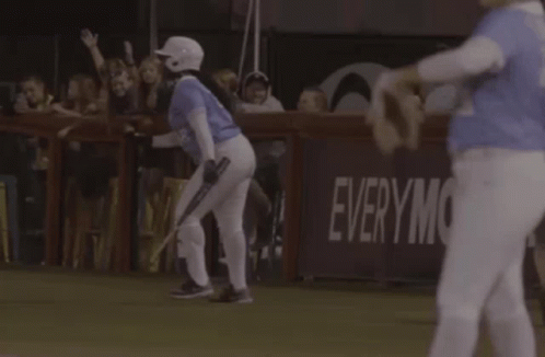 Baseball Player Walking with Everym Sign