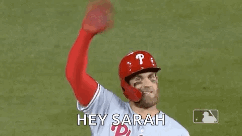 Baseball Player Waving Helmet and Gloves