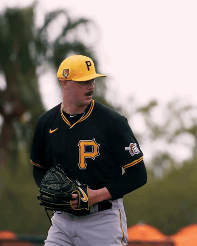 Baseball Player Wearing Black Jersey with Yellow P