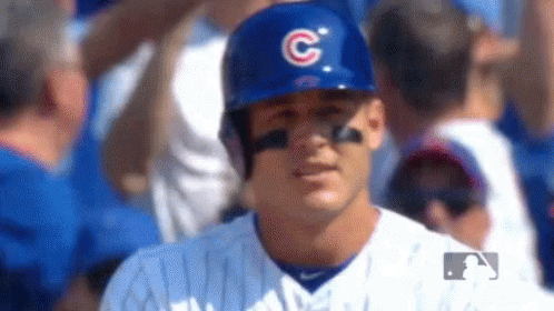 Baseball Player Wearing Helmet with C