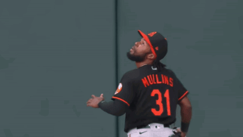 Baseball Player Wearing Number 31 Catches Ball
