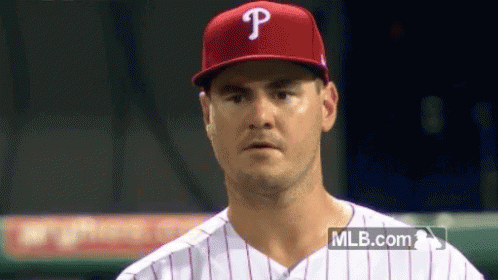 Baseball Player Wearing Red P Hat