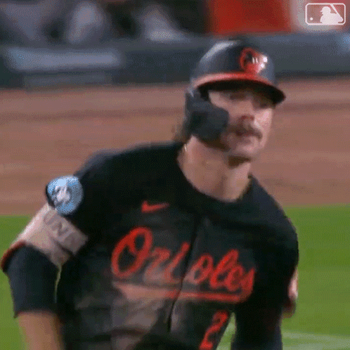 Baseball Player with Mustache in Orioles Jersey